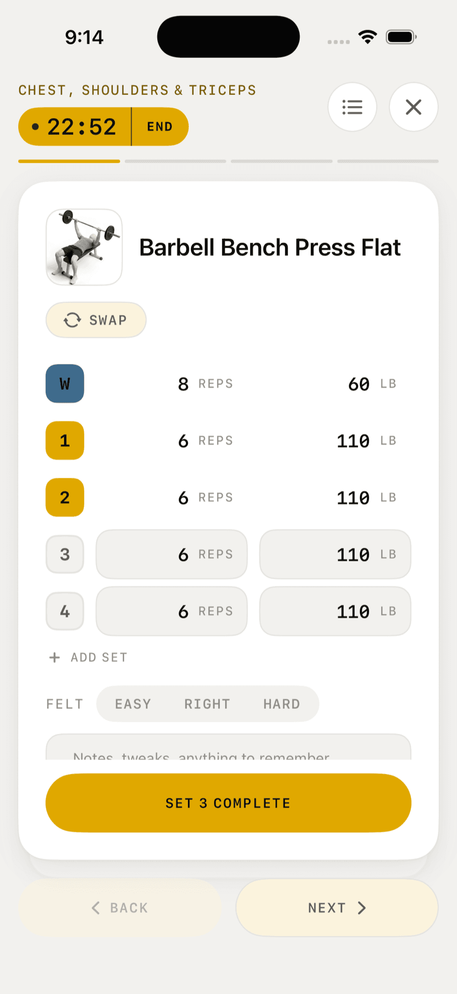 A workout in progress: the warm-up and first two sets ticked off, a rest timer counting down